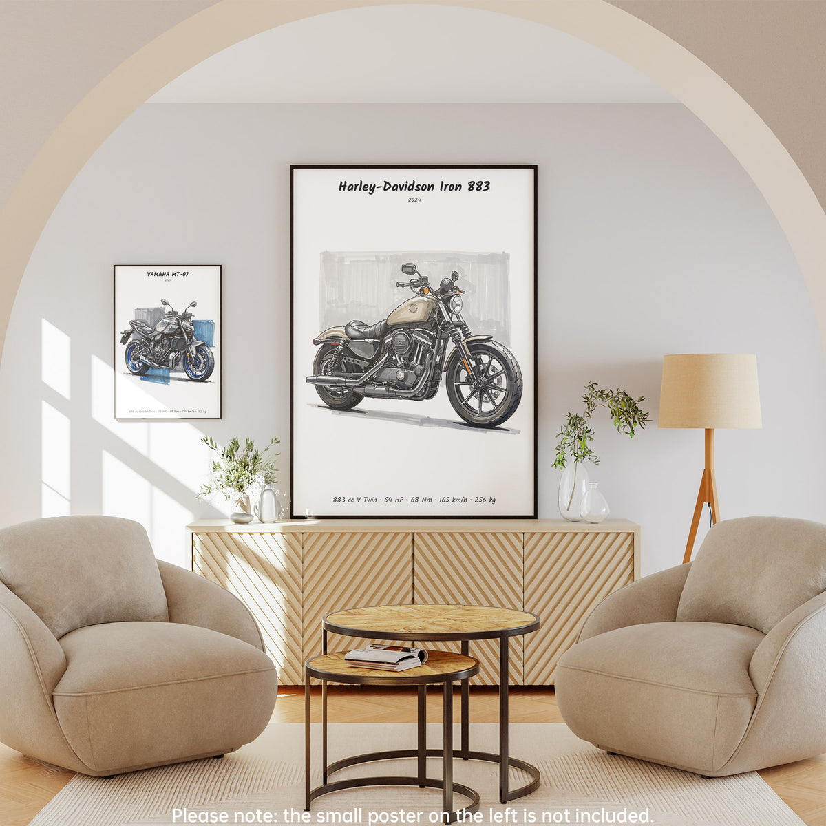 A framed wall poster featuring a vintage Harley-Davidson Iron 883 motorcycle print, displayed in a styled living room setting with two beige armchairs, a round wooden coffee table, and a cream floor lamp.