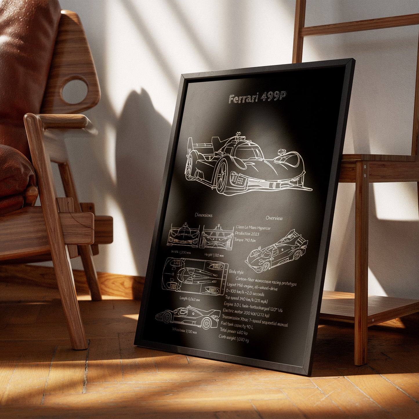 Framed poster of a Ferrari 499P car design on a wooden floor with a chair and table in the background.