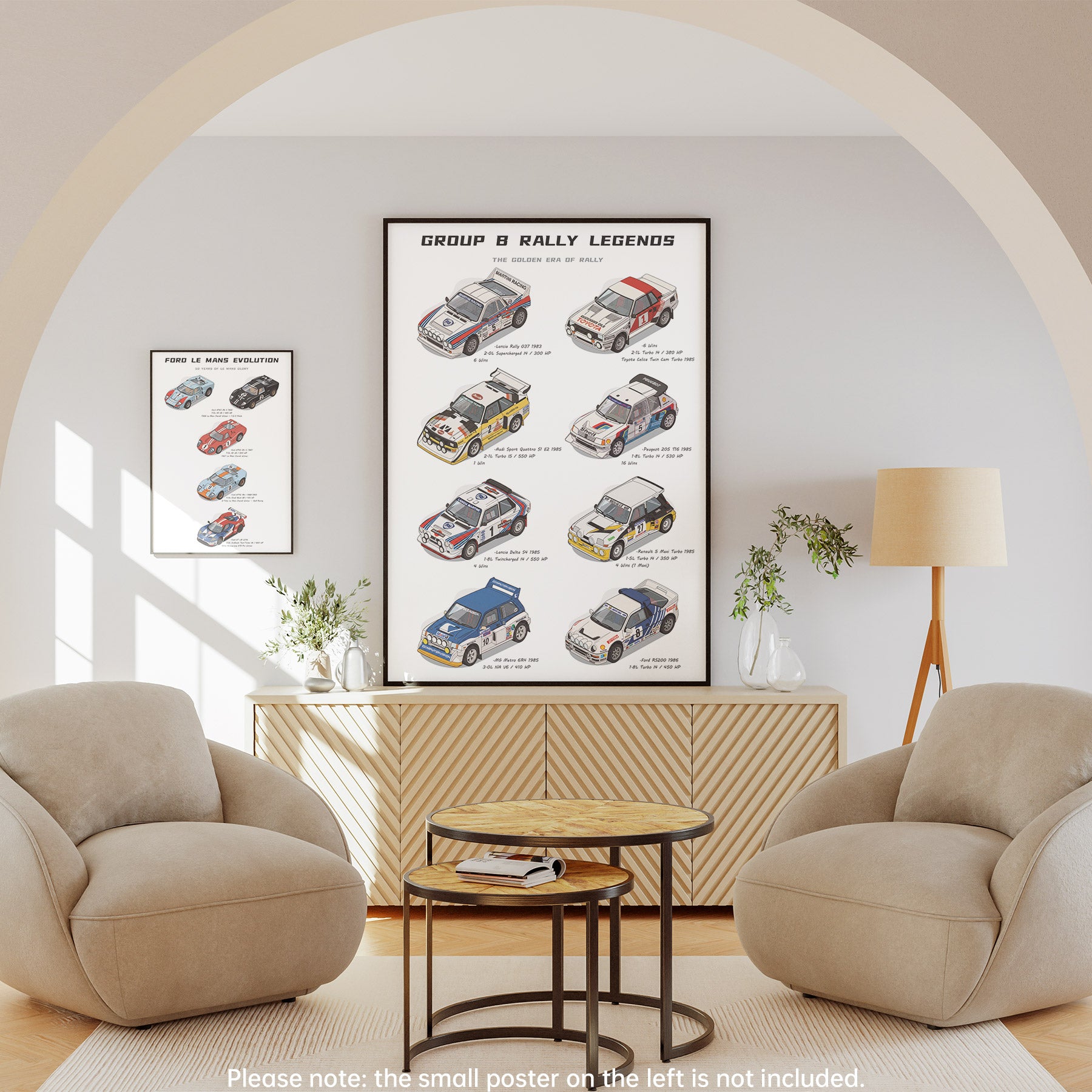 A framed wall poster titled 'Group B Rally Legends' hangs above a wooden cabinet in a styled living room with two beige armchairs, a small round table, and a floor lamp. The poster shows illustrated vintage rally cars.
