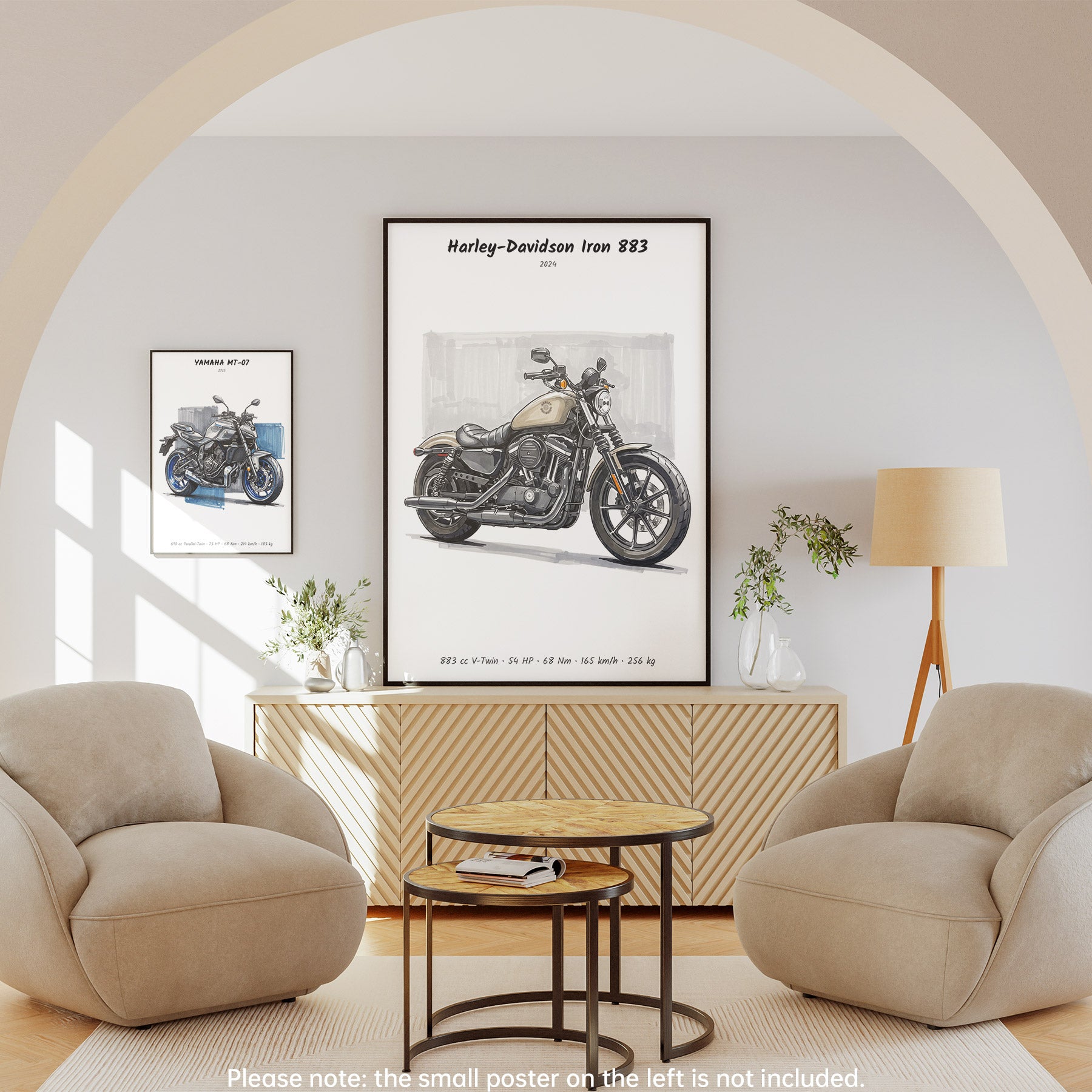 A framed wall poster featuring a vintage Harley-Davidson Iron 883 motorcycle print, displayed in a styled living room setting with two beige armchairs, a round wooden coffee table, and a cream floor lamp.