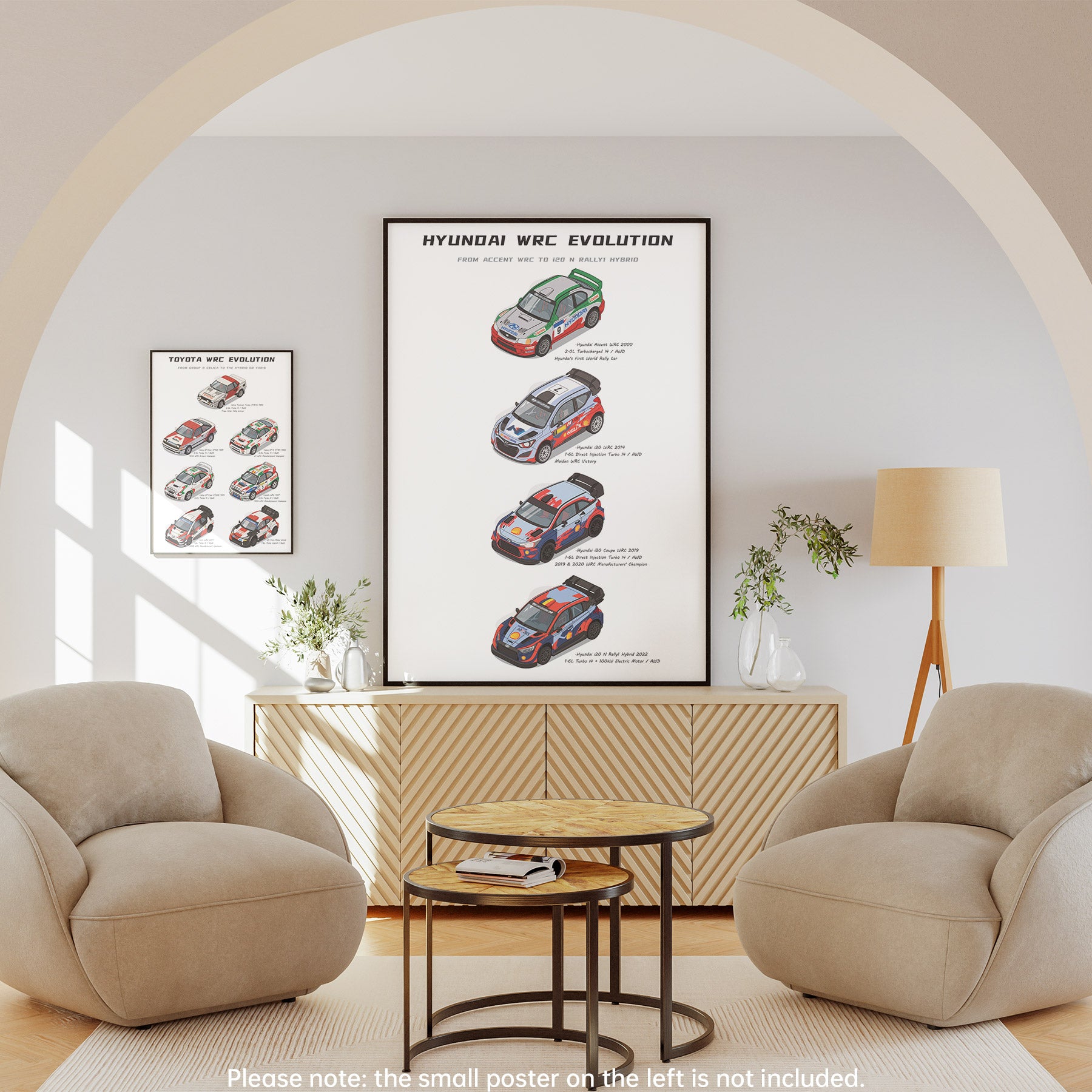 A framed wall poster showing Hyundai WRC Evolution race cars hangs above a wooden cabinet in a modern living room with two beige armchairs, a round coffee table, and a floor lamp. A smaller poster is visible on the left wall, and a note at the bottom says the small poster on the left is not included.