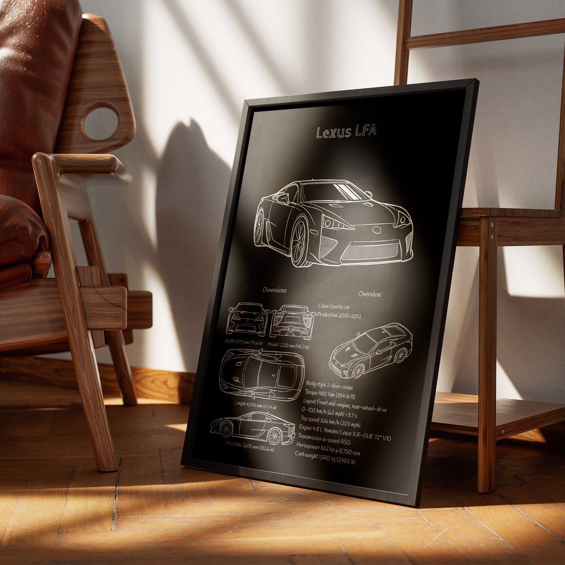 Framed Lexus LFA car blueprint on a wooden floor with a chair and table in the background