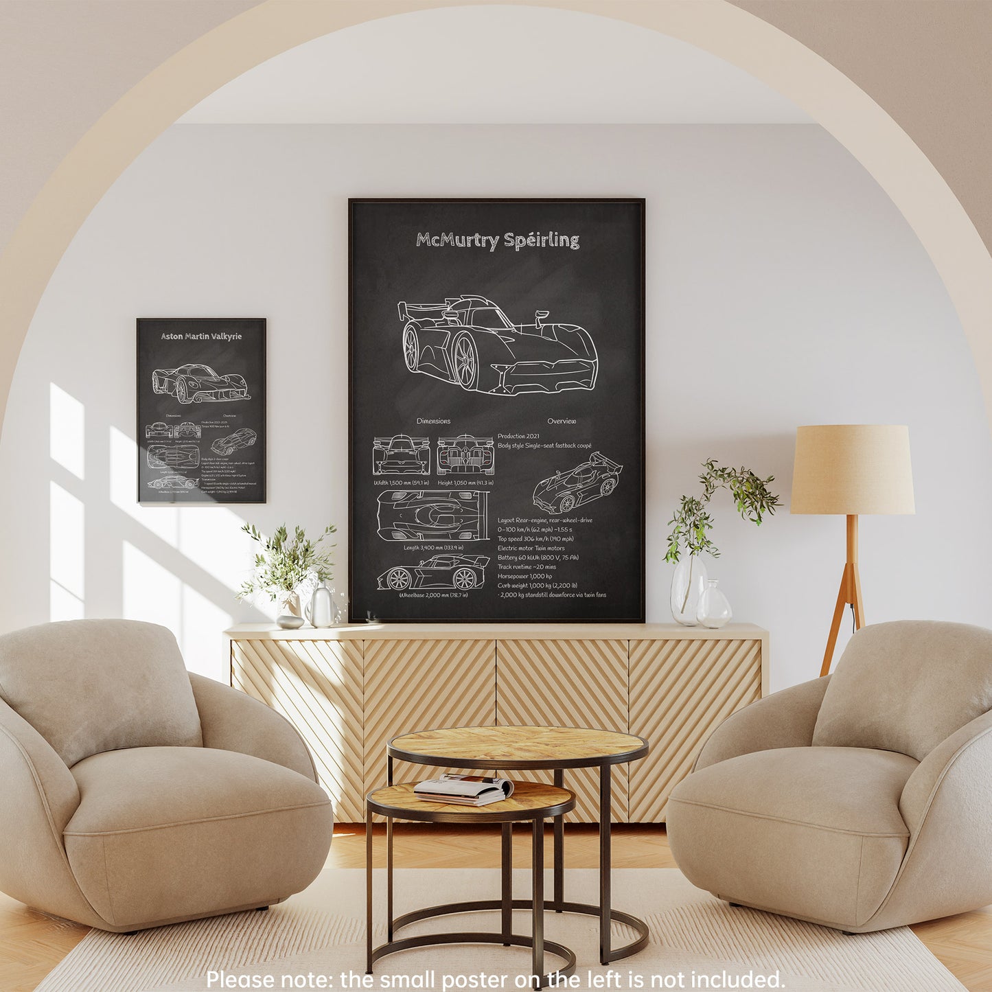 Modern living room with beige armchairs, a coffee table, and a wall with McMurtry Speirling posters.