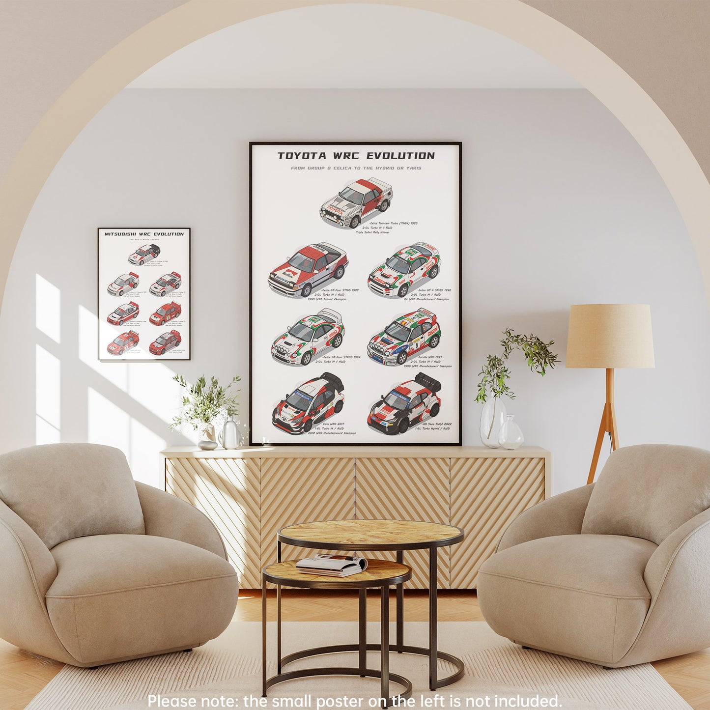 A framed wall poster titled 'Toyota WRC Evolution' hangs above a wooden cabinet in a styled living room with two beige armchairs, a small round table, and a floor lamp. The poster shows illustrated rally cars and text, and a smaller version of the poster is visible on the left wall.