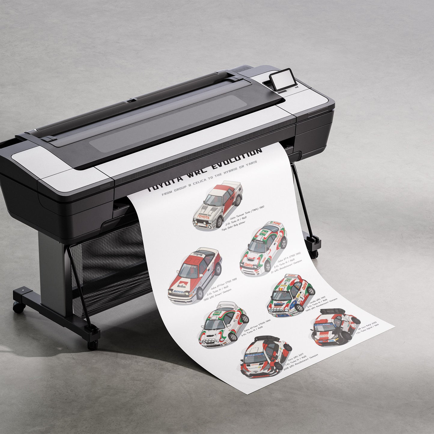 A large black and silver wide-format printer on a gray studio background, printing and releasing a long white poster sheet featuring illustrated race cars and the text 'TOYOTA WRC EVOLUTION'.
